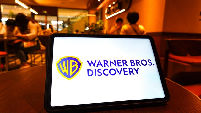 In this photo illustration,  the Warner Bros Discovery logo 